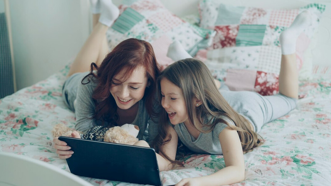 family using smart tablet